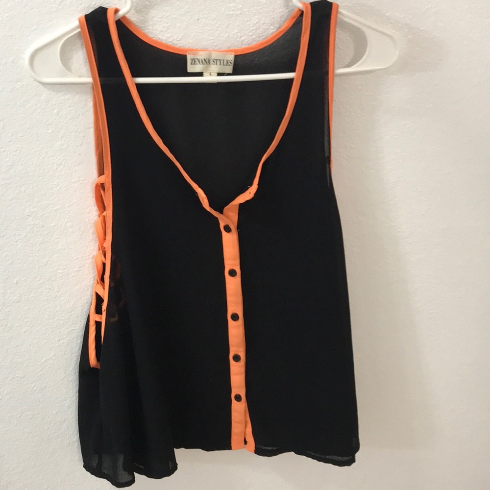 Black flow tank top with neon orange accents